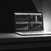 AI-powered trading platform displayed on a laptop with a globe.