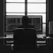 Automated trading setup with multiple screens displaying market data.