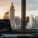 Hedge fund alternative investments on trading desk with city view.