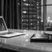 Financial chart on a laptop overlooking city skyline.