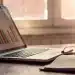 Nurp review complaints and BBB ratings on a laptop with charts and glasses.