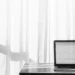 Laptop with financial chart, wealth management webinar.