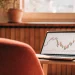 Stock trading chart on a laptop.