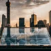 Stock market graph against city skyline.