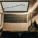 AI trading app charts displayed on a laptop and smartphone.