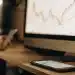 Best free AI stock pickers analyze charts on computer and phone.