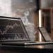 AI day trading apps on laptop and smartphone.