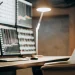 Automated bot trading setup with market charts on multiple monitors.