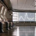 AI stock trading software analyzes market data on digital screens.