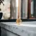 Gold bitcoin coin on marble surface. Bitcoin ETF investment.