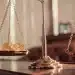Bitcoin vs. gold on balanced scales.