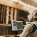 Stock trading bot analyzing market data on multiple screens.