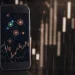 AI investing app on smartphone displaying charts and data.